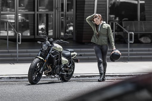 Three-quarter front angle of a motorcycle parked. opens in a new window