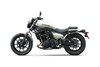Profile angle of a motorcycle staged in a white studio background.