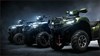 Side angle of 3 ATVs staged in a black studio background.