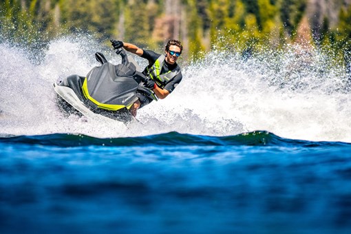 Front angle of a person on a personal watercraft on the water. opens in a new window