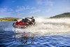 Front three-quarter turning angle of a person on a personal watercraft on the water.