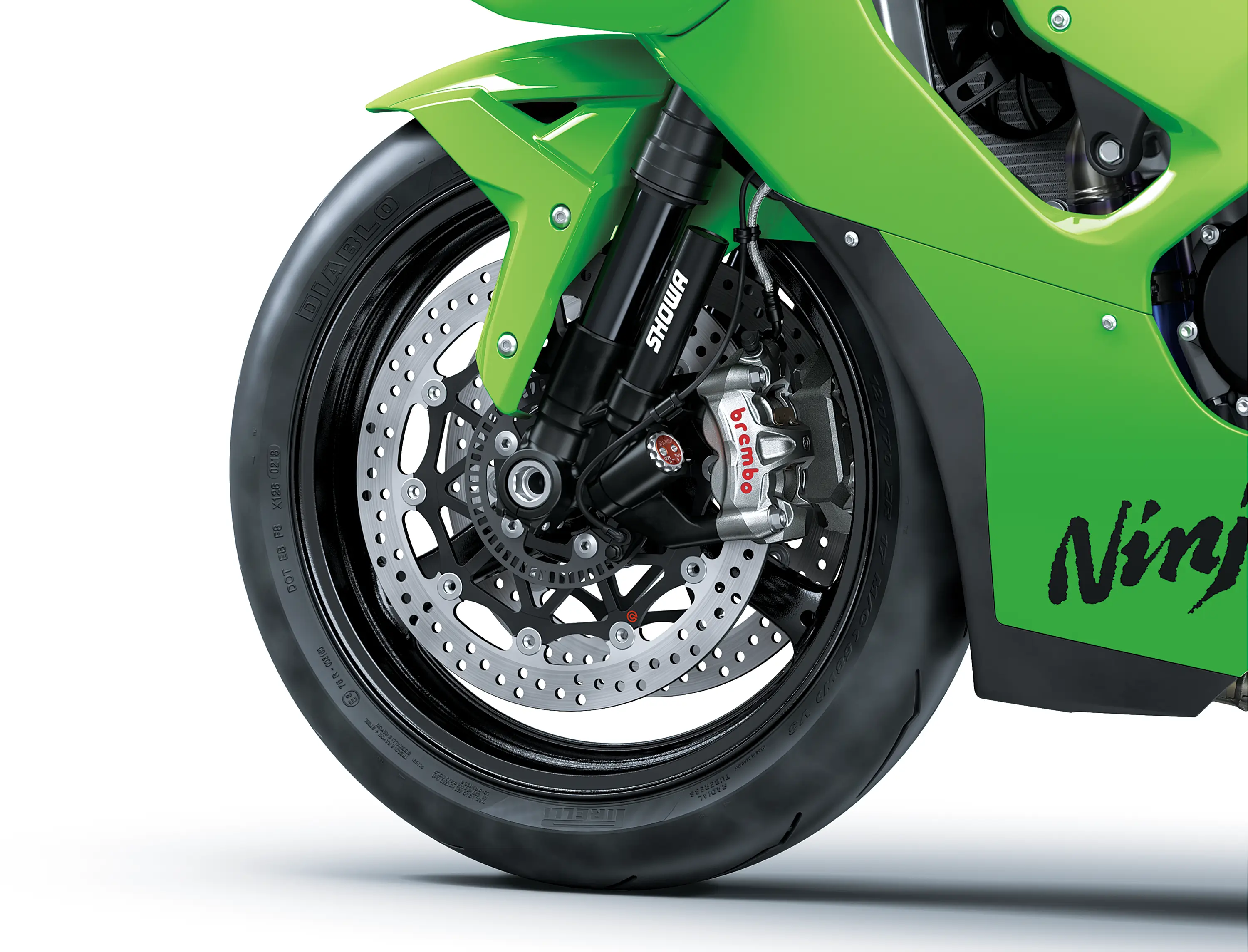 Close-up of the front tire of a motorcycle staged in a white studio background.