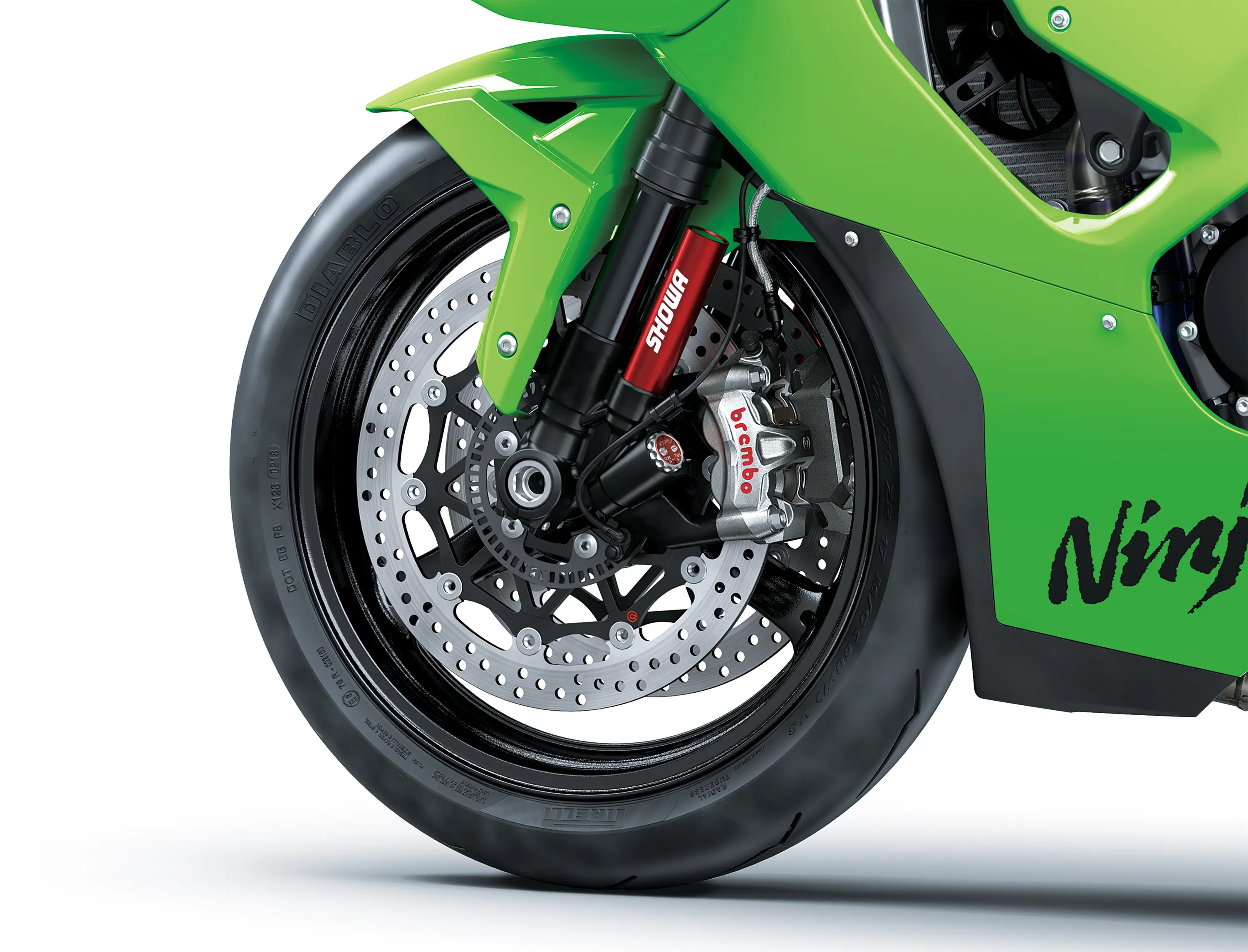 Close-up of the front tire of a motorcycle staged in a white studio background.