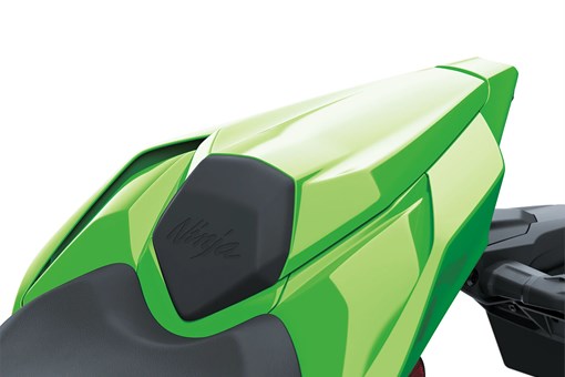 Close-up of the seat of a motorcycle staged in a white studio background. opens in a new window