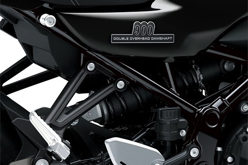 Close-up of the frame of a motorcycle staged in a white studio background. opens in a new window