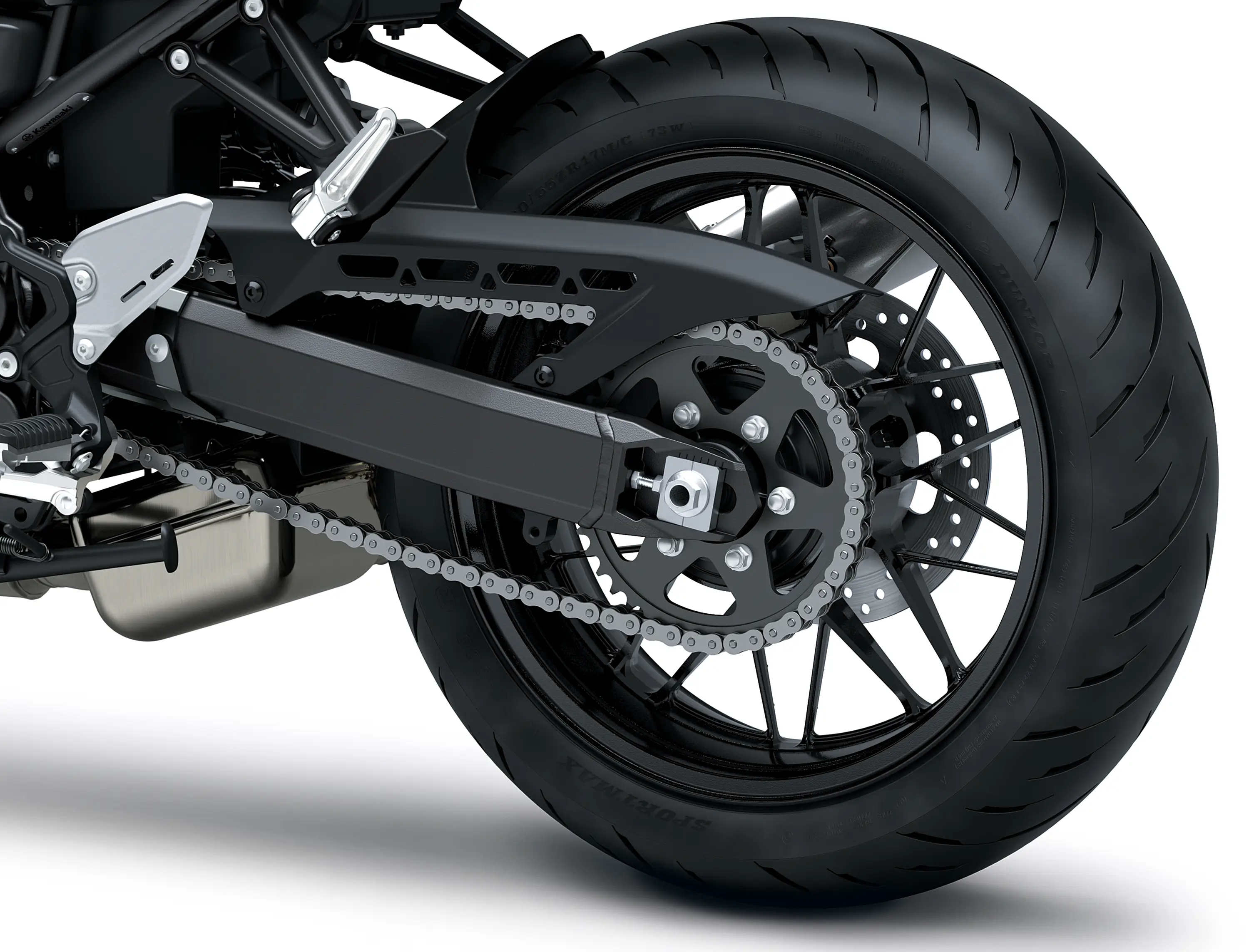 Close-up of the rear tire of a motorcycle staged in a white studio background.