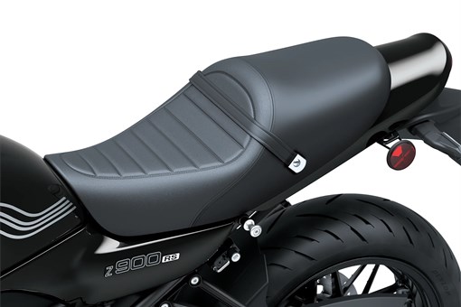 Close-up of the seat of a motorcycle staged in a white studio background. opens in a new window