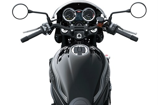 Rider POV of the handlebars of a motorcycle staged in a white studio background. opens in a new window