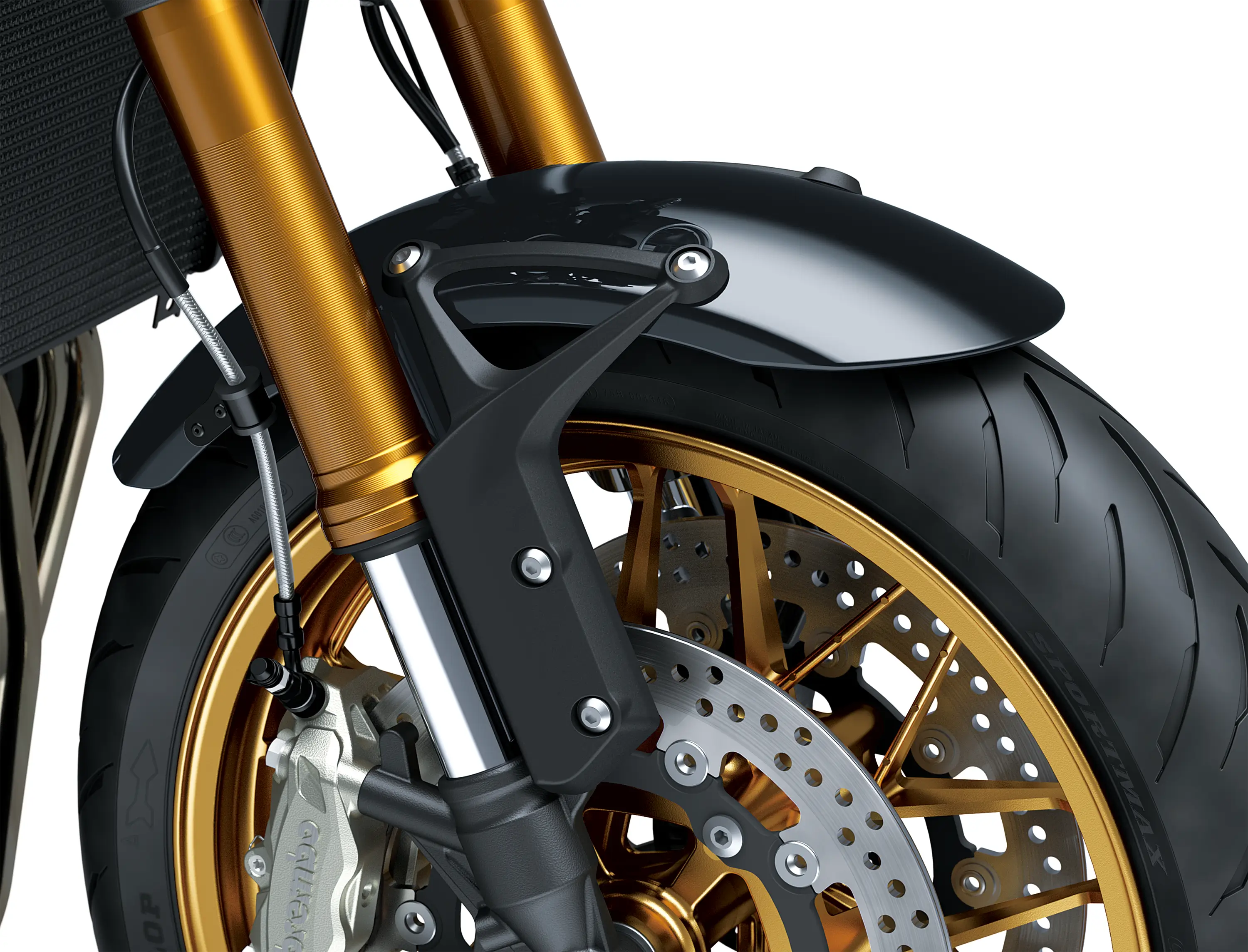 Close-up of the front tire of a black motorcycle staged in a white studio background.