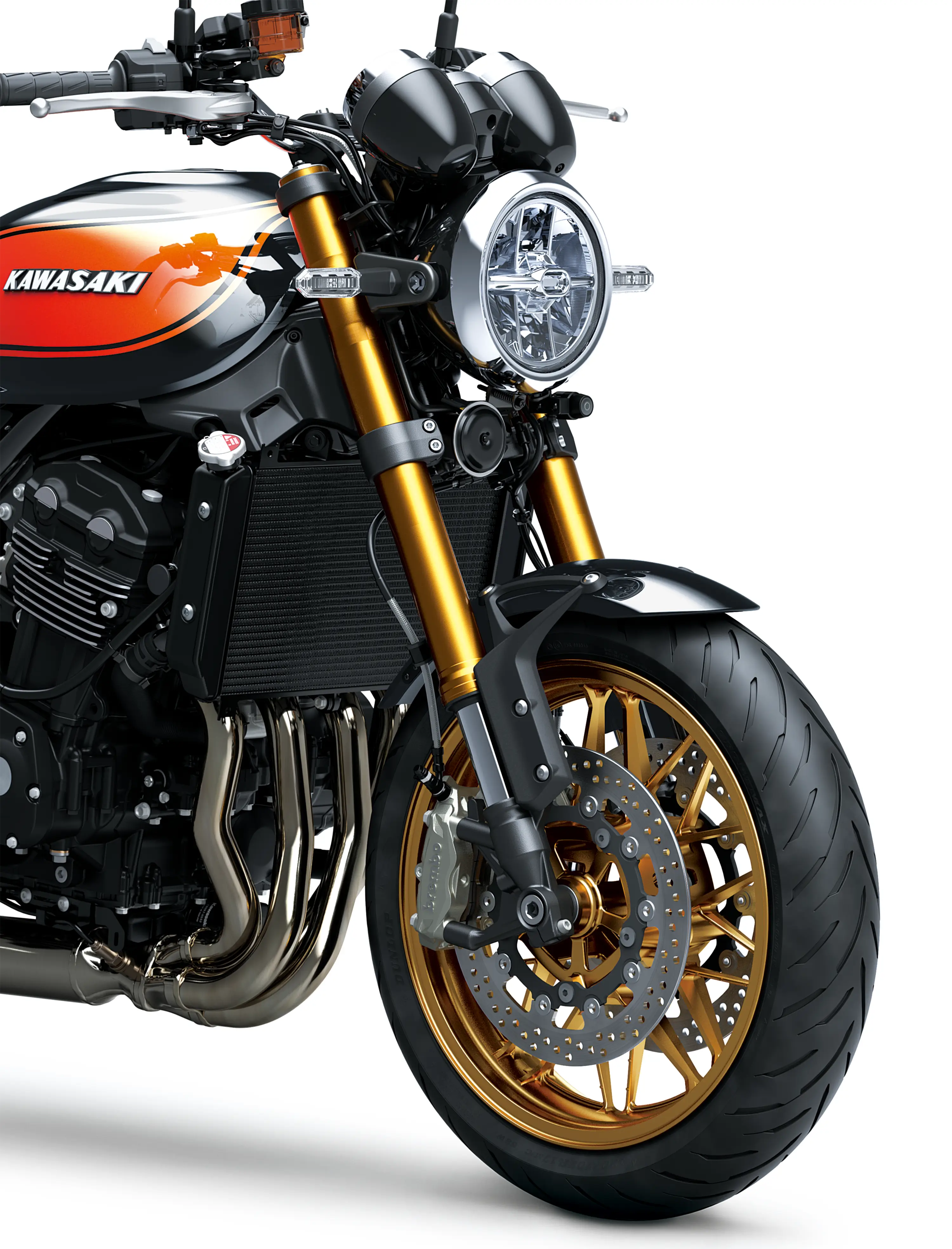 Close-up of the front end of a black motorcycle staged in a white studio background.