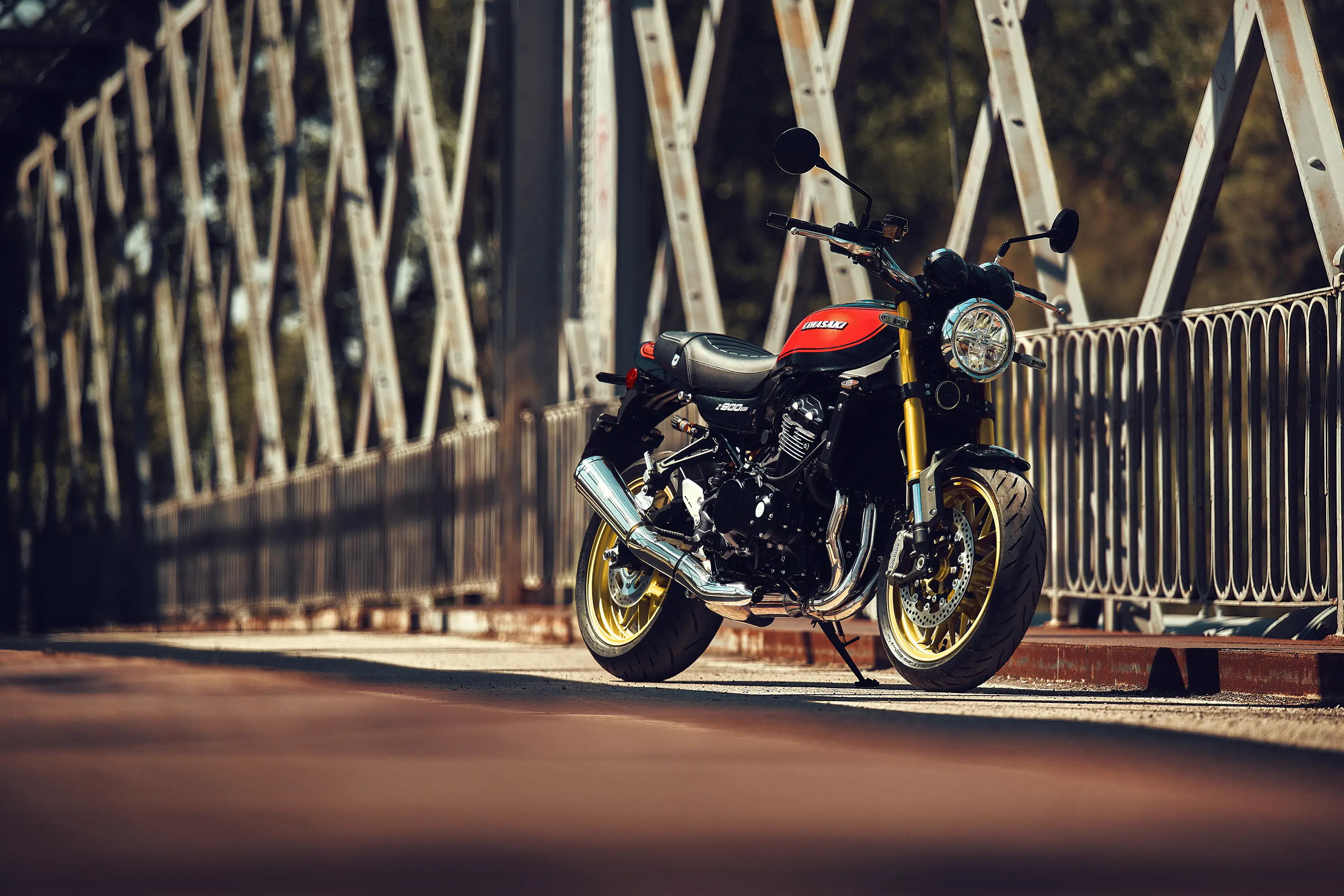 Three-quarter front angle of a motorcycle staged on a bridge.