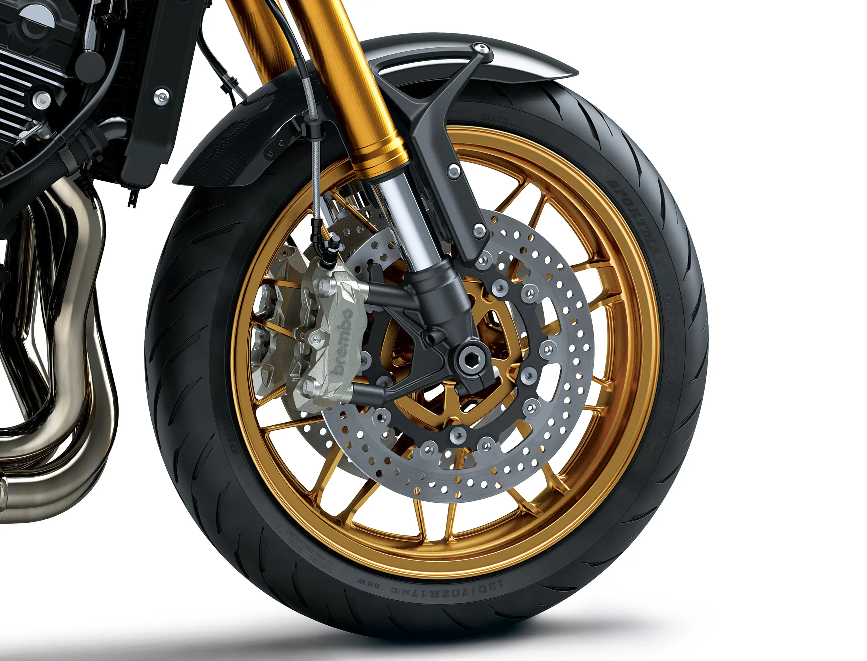 Close-up of the front tire of a motorcycle staged in a white studio background.