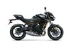 Profile angle of a motorcycle staged in a white studio background.