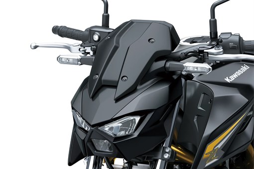 Closeup front angle of a motorcycle staged in a white studio background. opens in a new window
