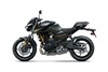 Profile angle of a motorcycle staged in a white studio background.