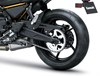 Rear wheel of a motorcycle staged in a white studio background.