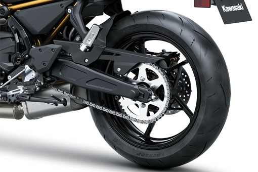 Rear wheel of a motorcycle staged in a white studio background. opens in a new window