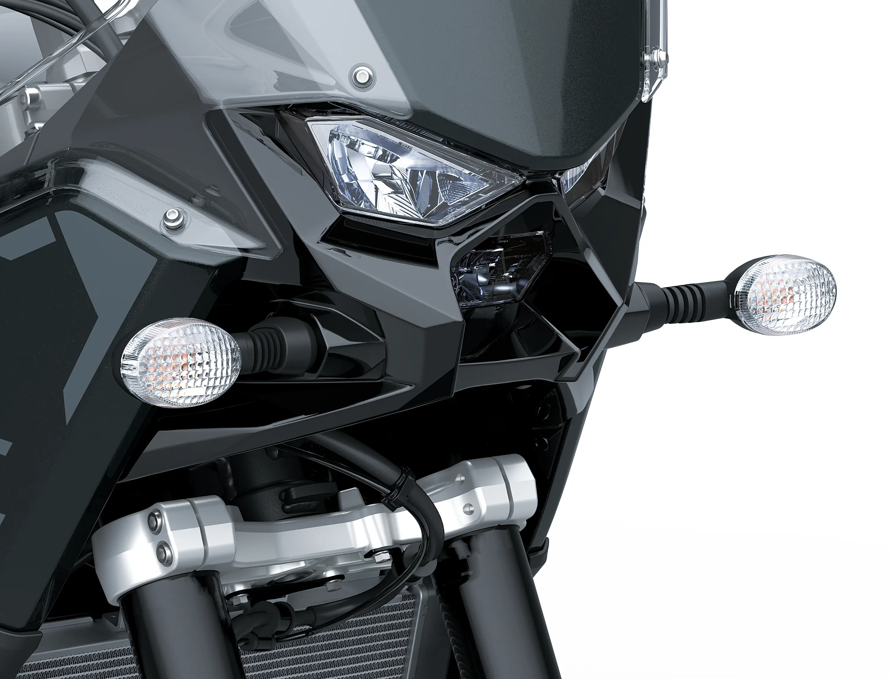 Front close in on headlights of a motorcycle staged in a white studio background.