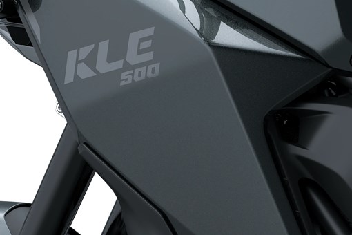 Side close on model logo of a motorcycle staged in a white studio background. opens in a new window