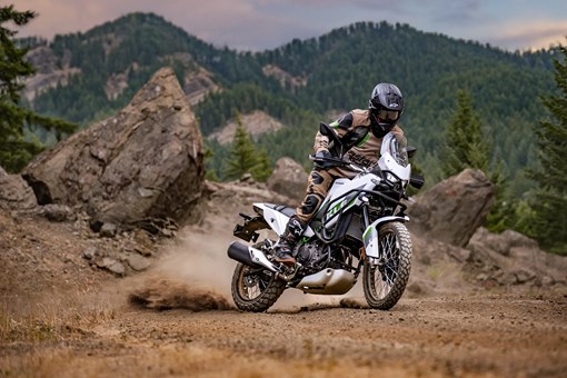 Side angle of a person riding a motorcycle off-road. opens in a new window