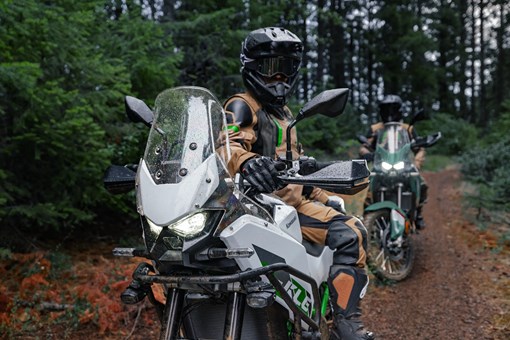 Three-quarter front angle of two motorcycles parked. opens in a new window