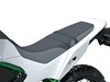 Another closeup on seat of a motorcycle staged in a white studio background.