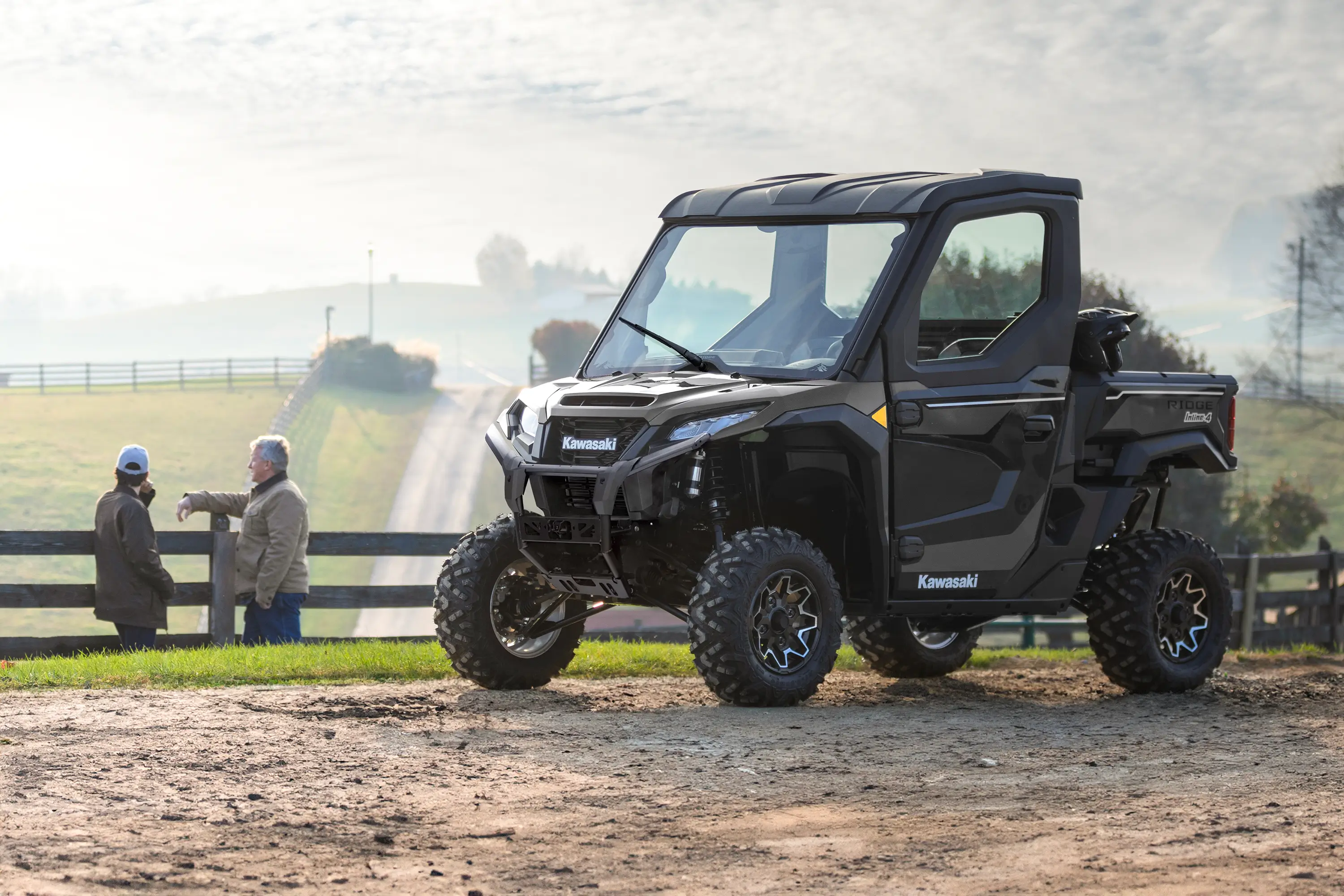 Three-quarter front angle of a side x side parked off-road.