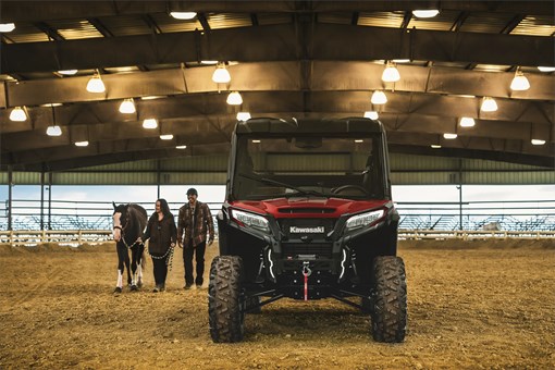 Front angle of a side x side parked in a horse paddock. opens in a new window