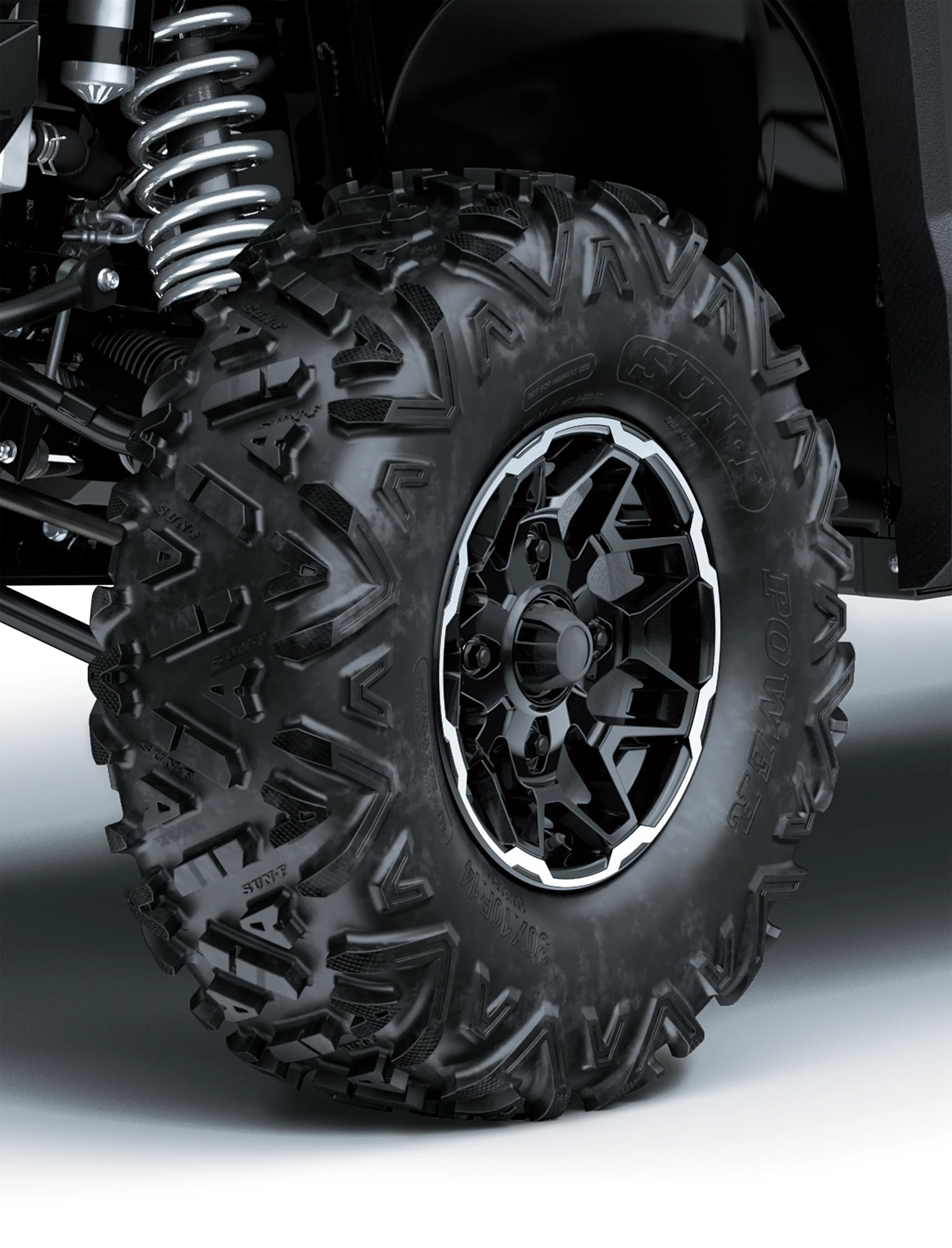 Close-up of a tire of a side x side in a white studio background.