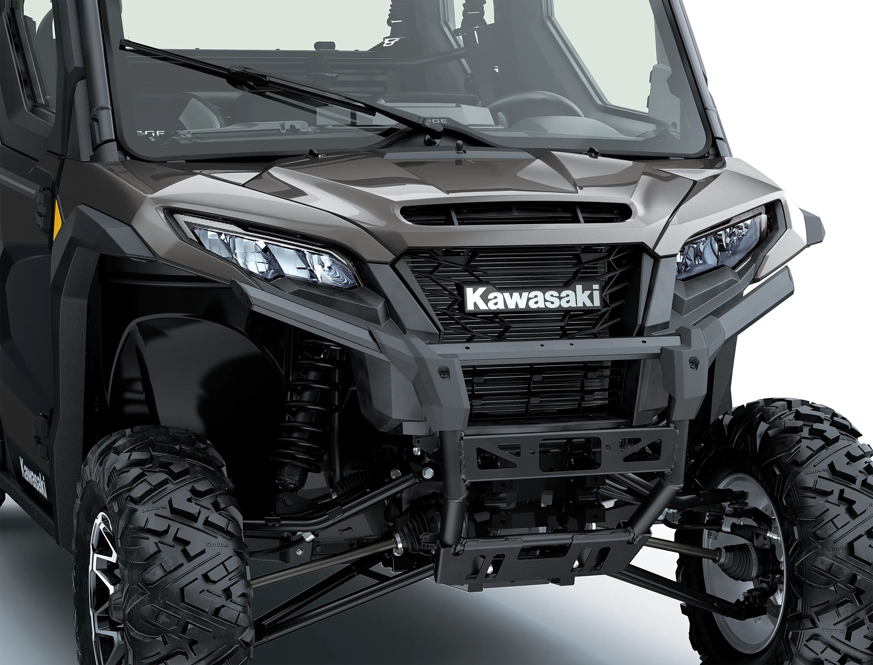 Close-up of the front end of a side x side in a white studio background.