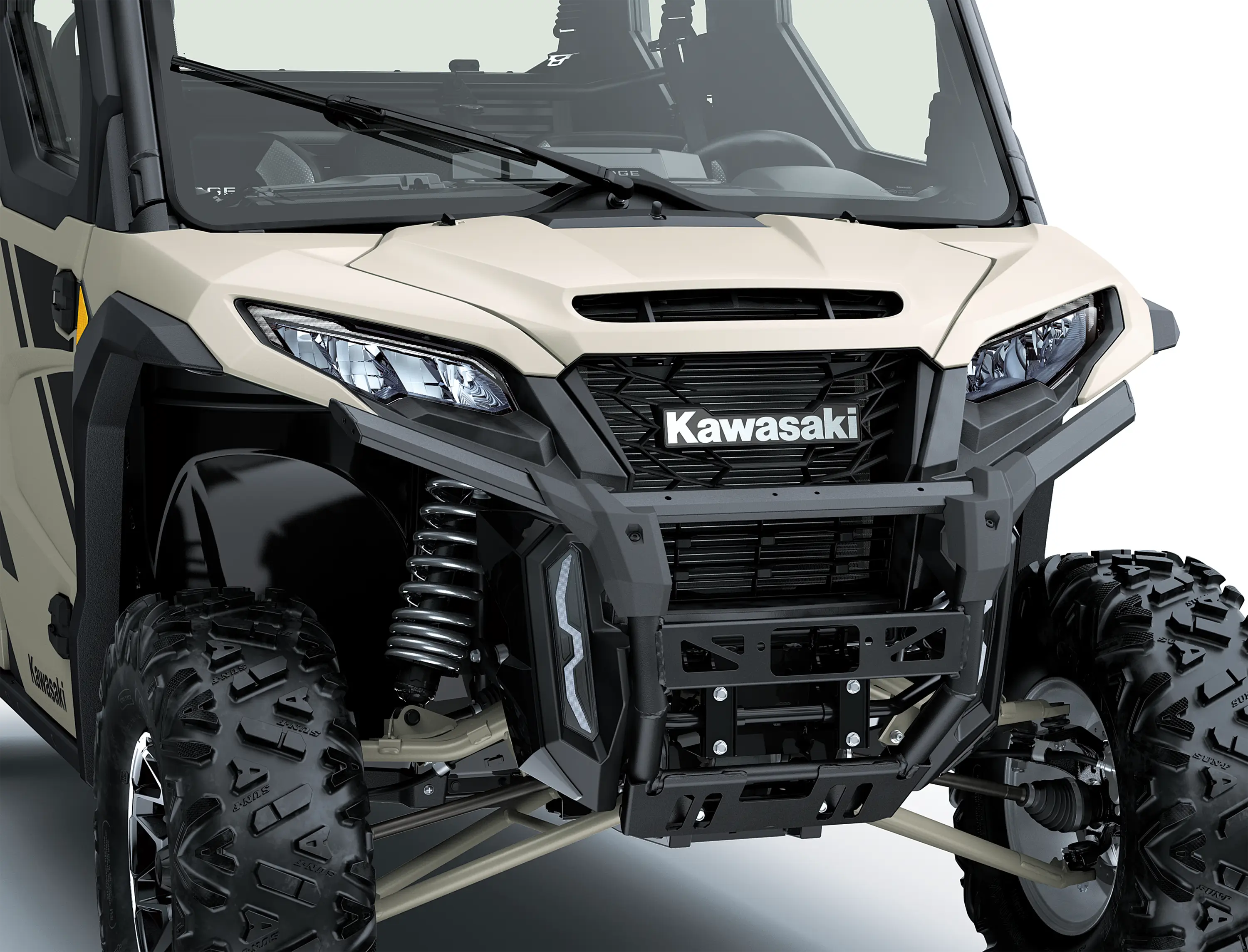 Close-up of the front end of a side x side in a white studio background.