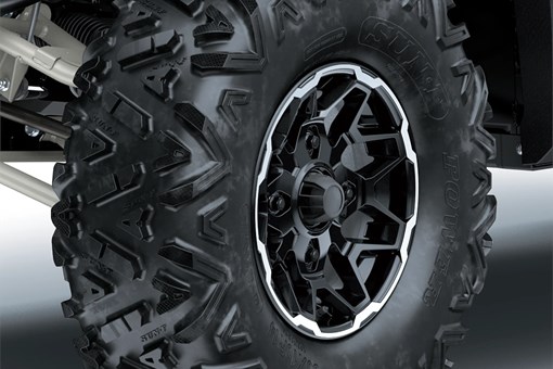 Close-up of wheels of a side x side in a white studio background. opens in a new window