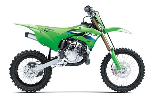Right side view of a green youth dirt bike in a white studio background. opens in a new window