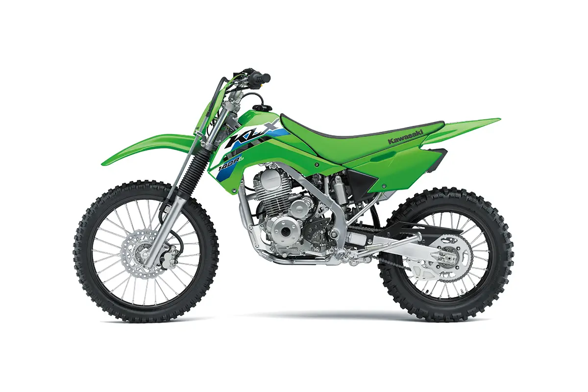 Left side view of a green youth dirt bike staged in a white studio background.