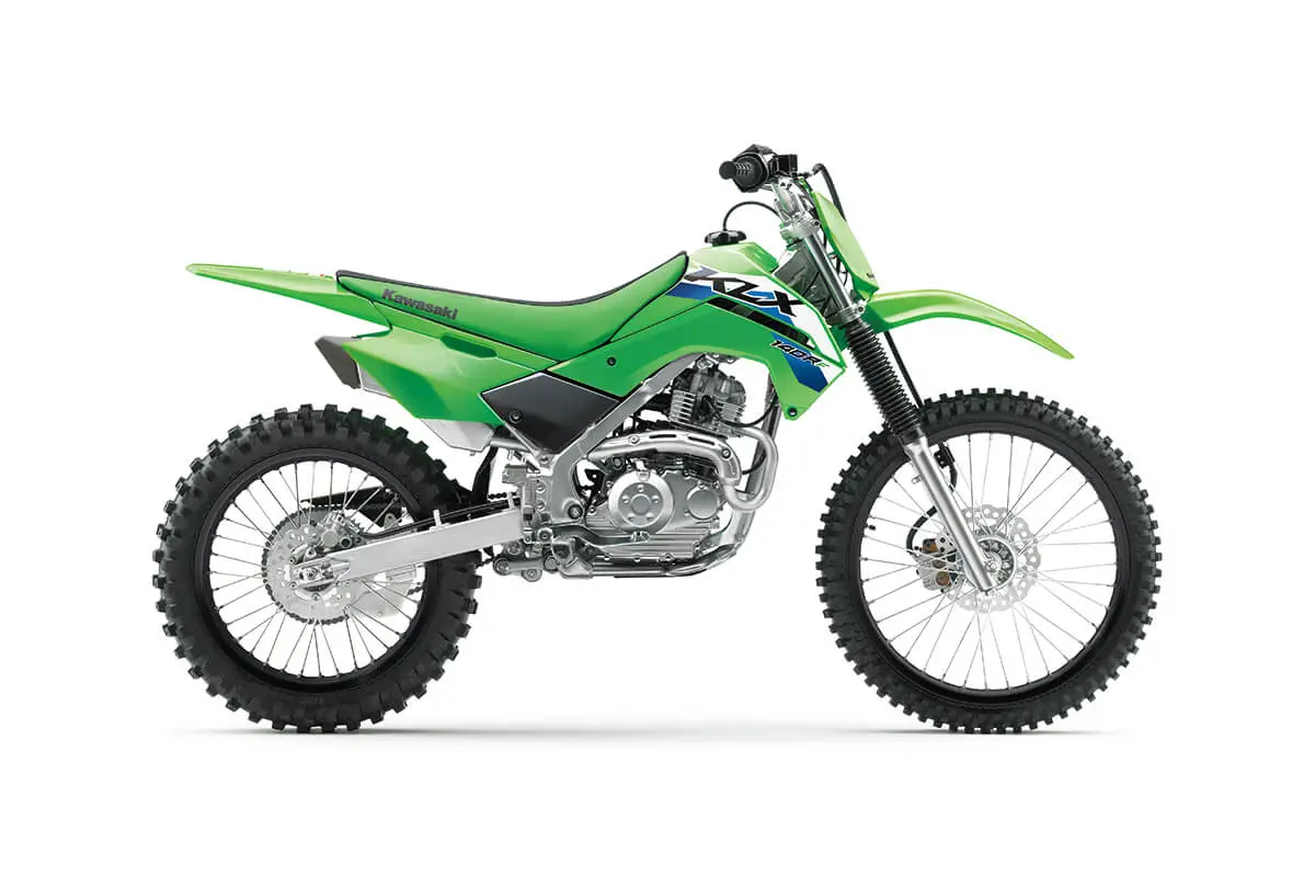 Right side view of a green dirt bike staged in a white studio background.