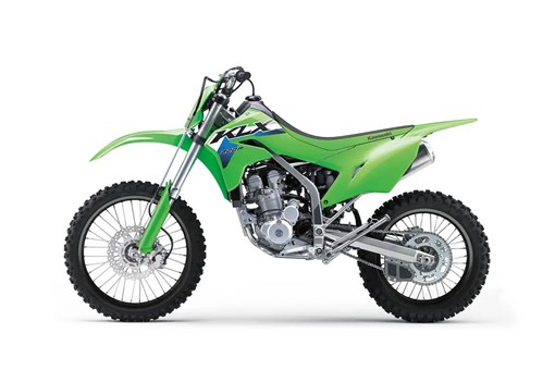 Left side view of a green dirt bike staged in a white studio background. opens in a new window