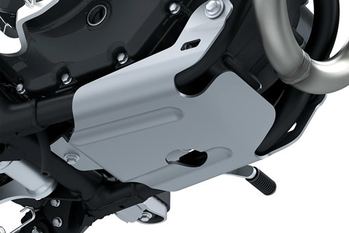 Close-up view of the underside of a motorcycle staged in a white studio background. opens in a new window