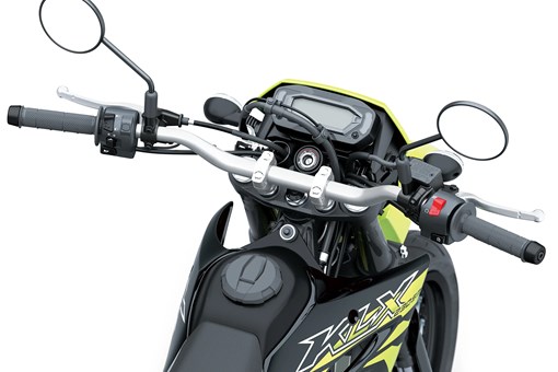 Driver POV of the handlebars of a motorcycle staged in a white studio background. opens in a new window