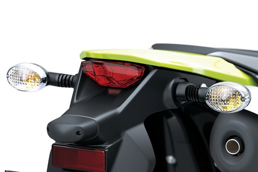 Close-up of the taillights of a motorcycle staged in a white studio background. opens in a new window