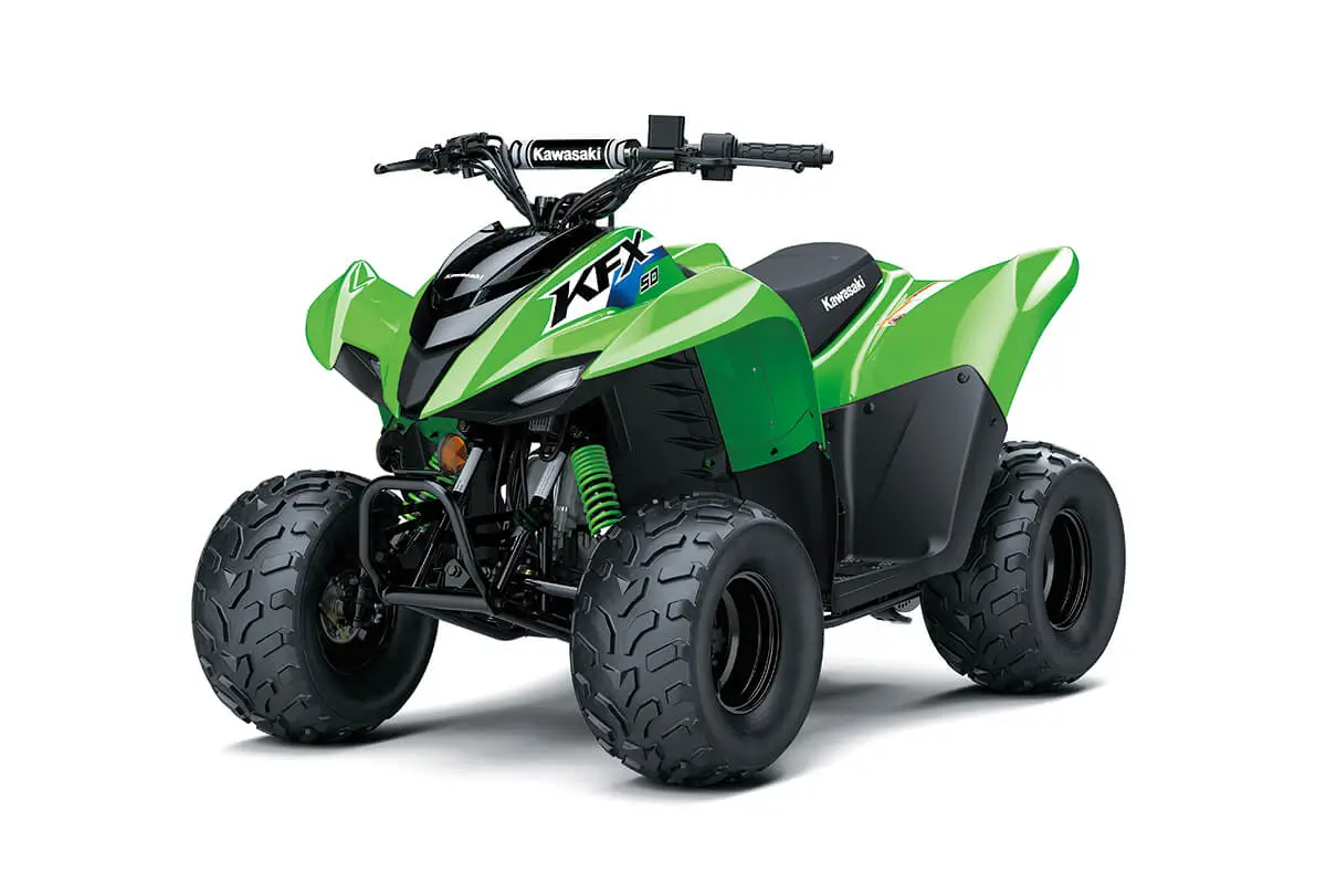 Front three-quarter view of a green youth ATV in a white studio background.
