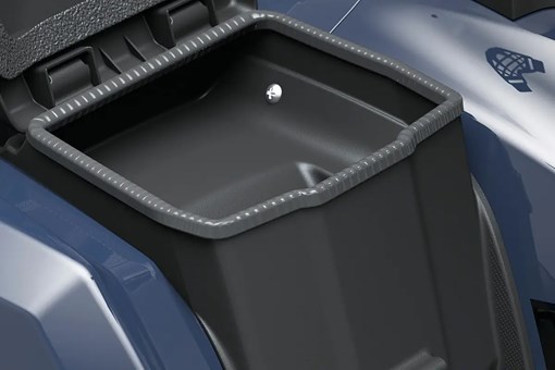Detail view of an enclosed storage compartment on a utility ATV in a white studio background. opens in a new window