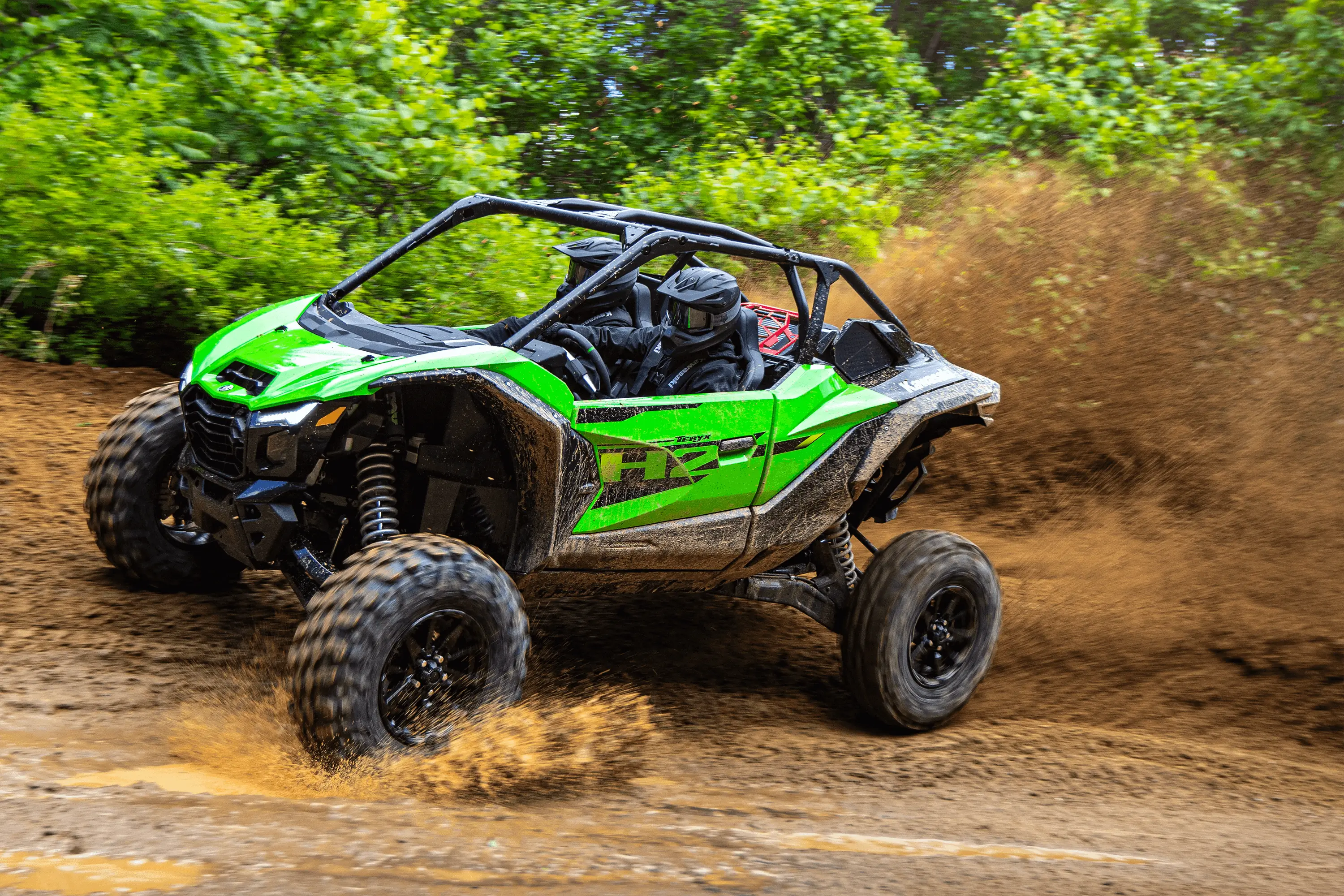 Side angle of a person driving a side x side off-road.