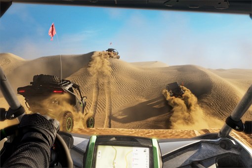 Interior angle of side x side driving in the dunes. opens in a new window