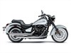 Profile angle of a motorcycle displayed in a white studio background.