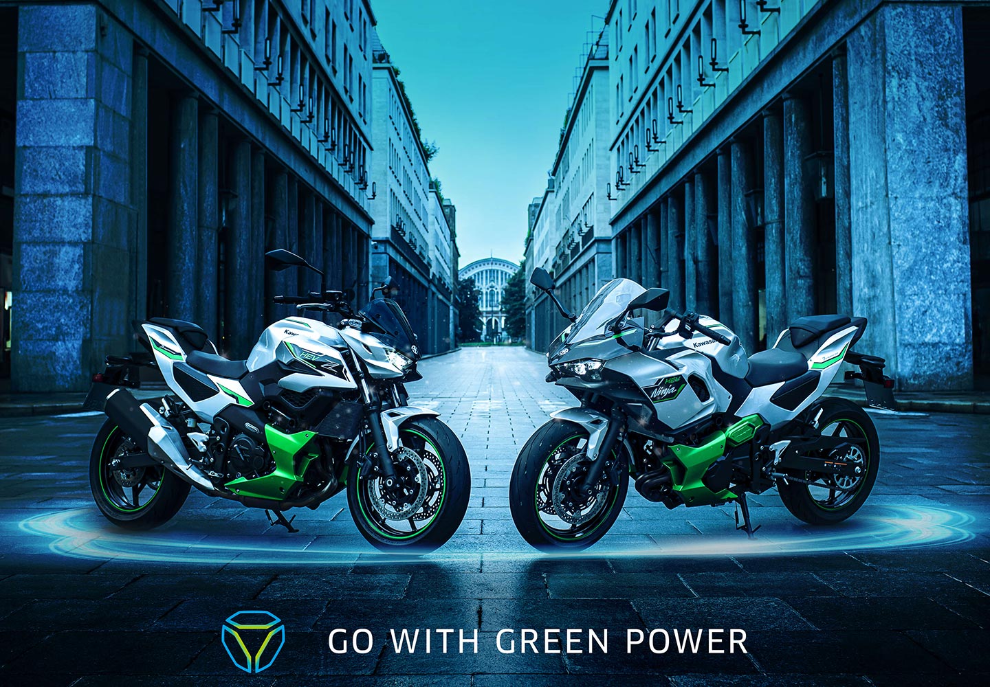 View of two electric motorcycles posing in front of buildings.